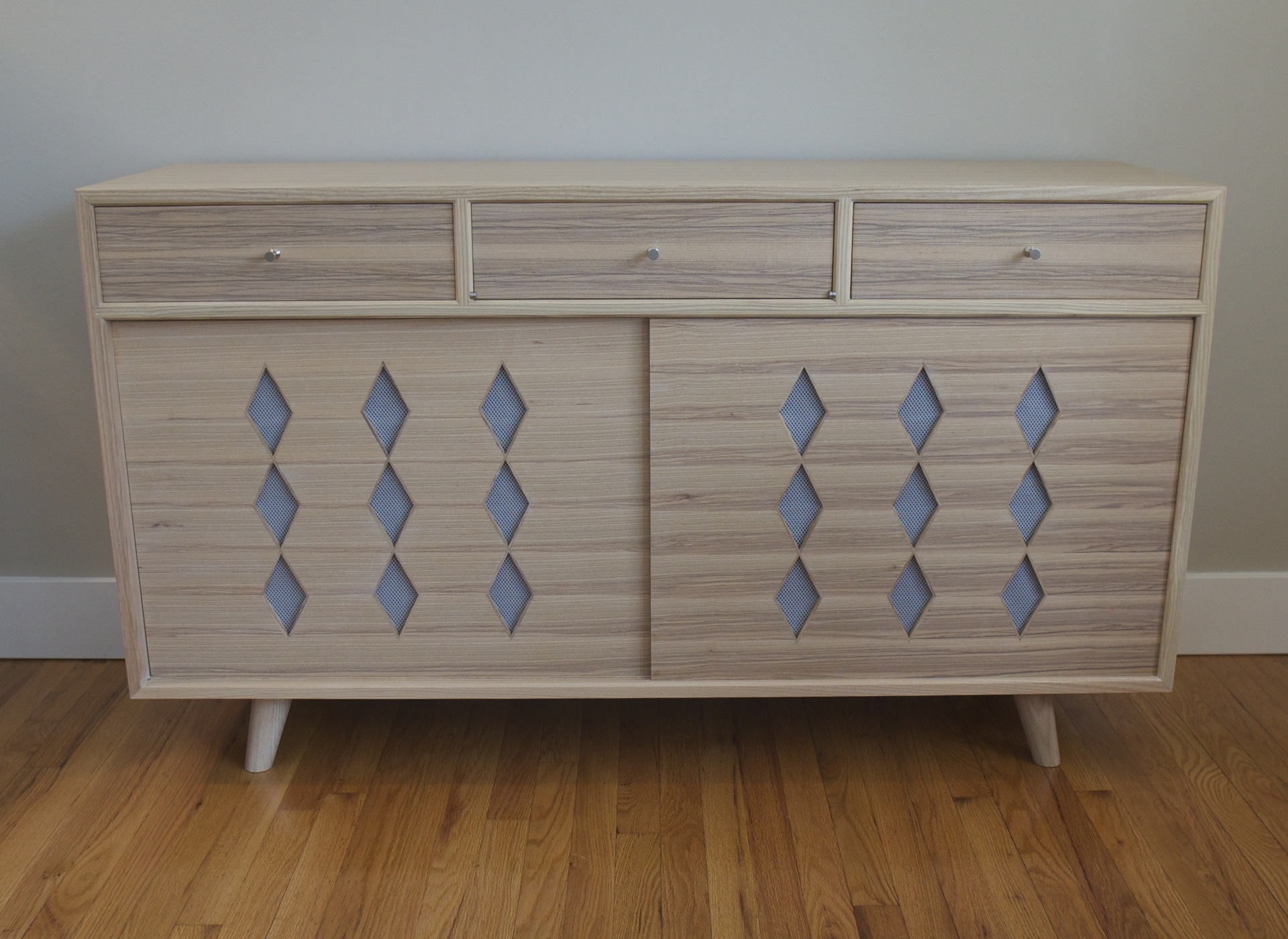 Full front view of a mid century modern LP console in ash